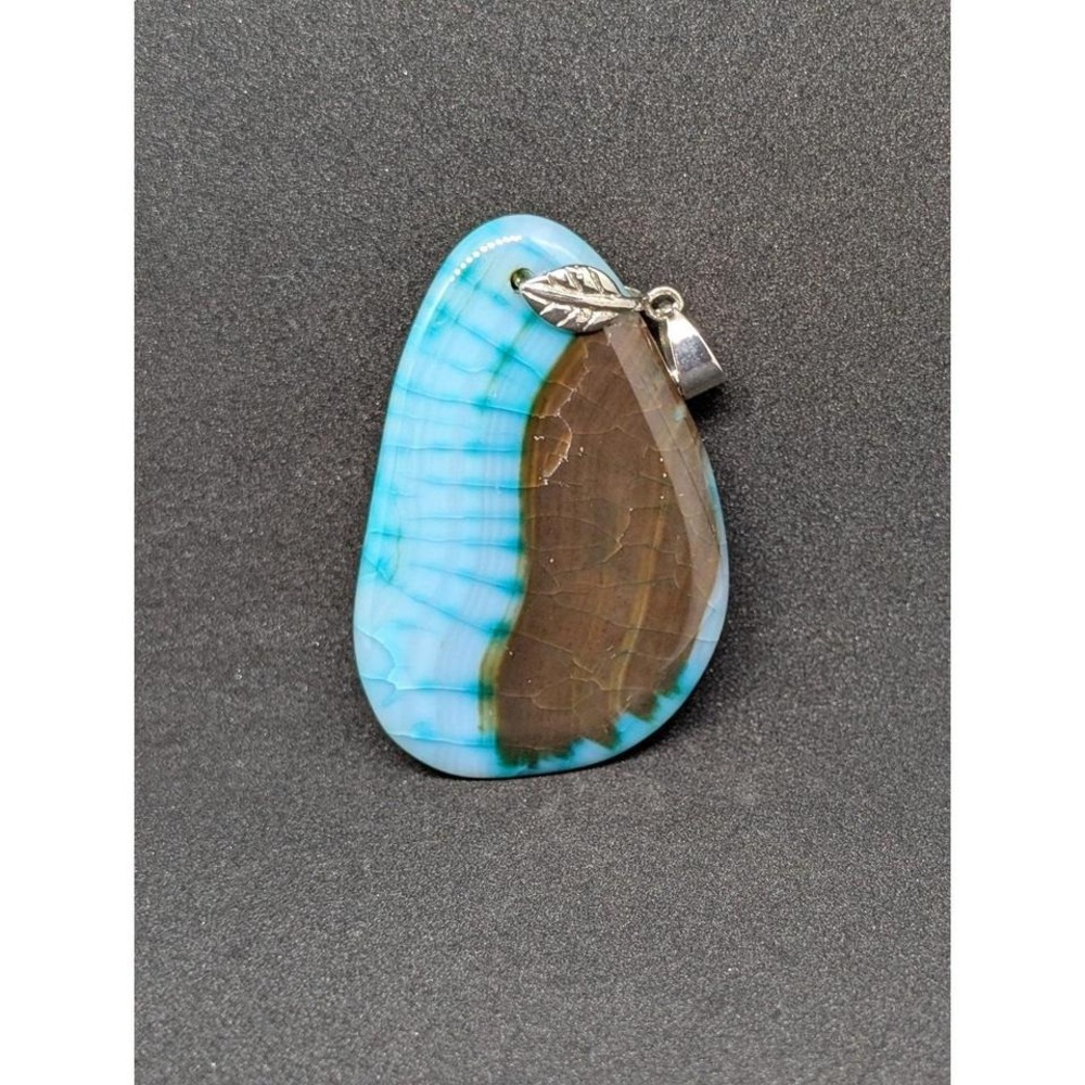 Fire Agate Pendant 
Approximately 2 and 1/2 by‎ 1 and 1/2